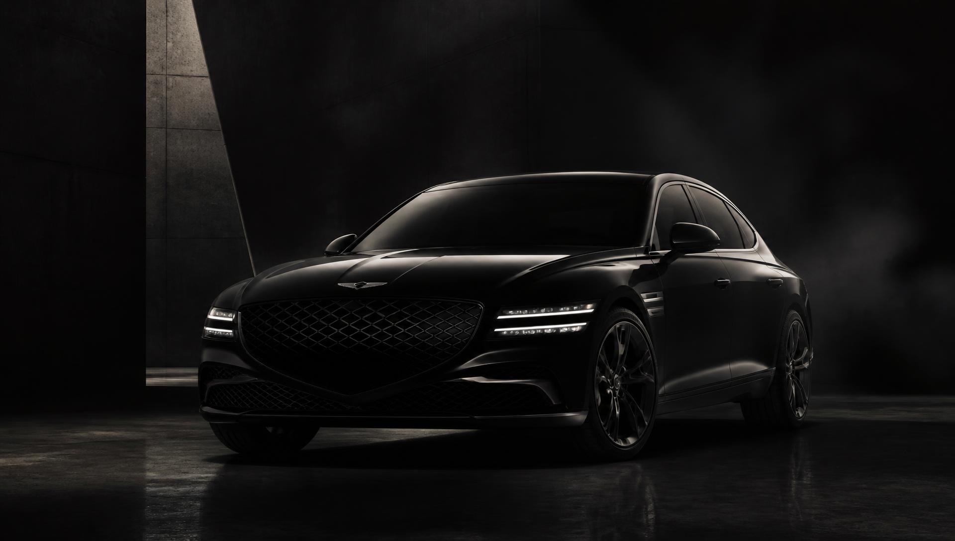 Luxury sedan lit in a dark studio